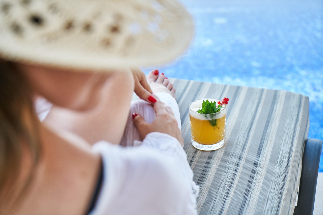 Services woman, resort, hotel, holiday, ocean, girl, sea, beach, trip, sun, coast, white, beauty, tropical, drink, nature, cocktail, pool, relax, hat, wicker, beautiful, summer